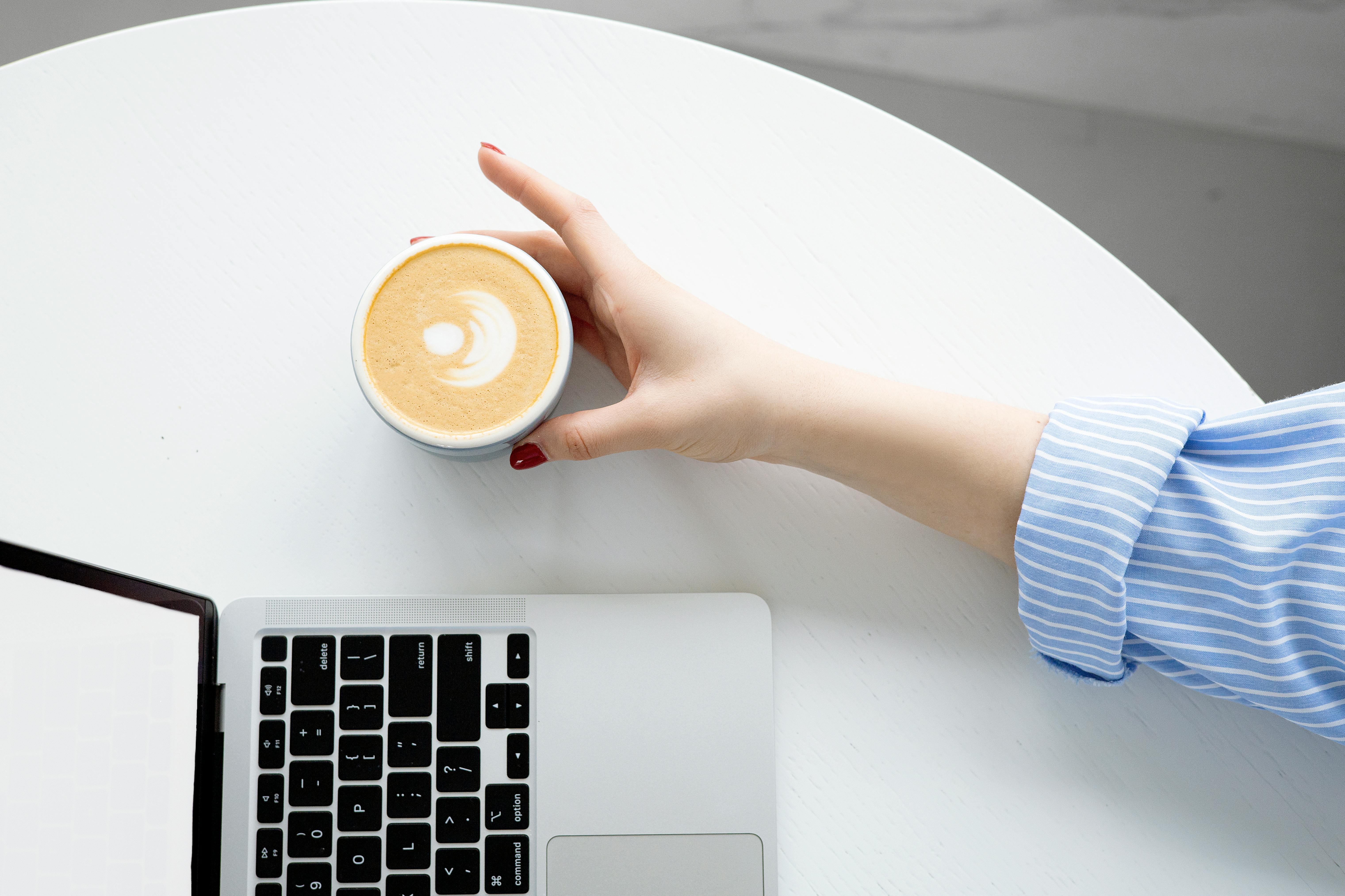 Coffee and laptop workspace